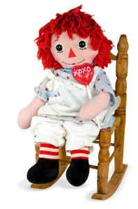 old rag doll with heart lollipop