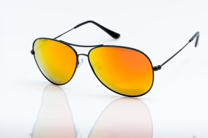 Yellow sunglasses isolated on white background
